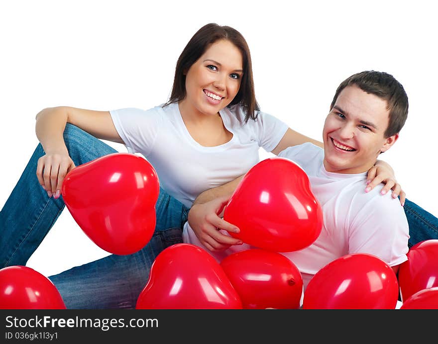 Young couple with a hearts over white background