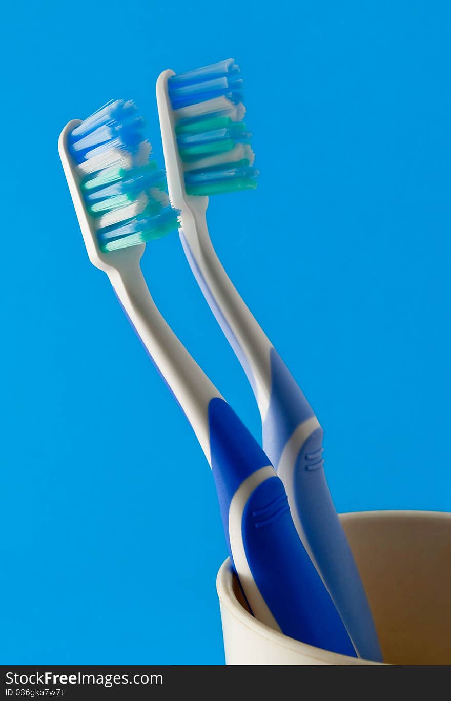 Toothbrushes in a plastic cup