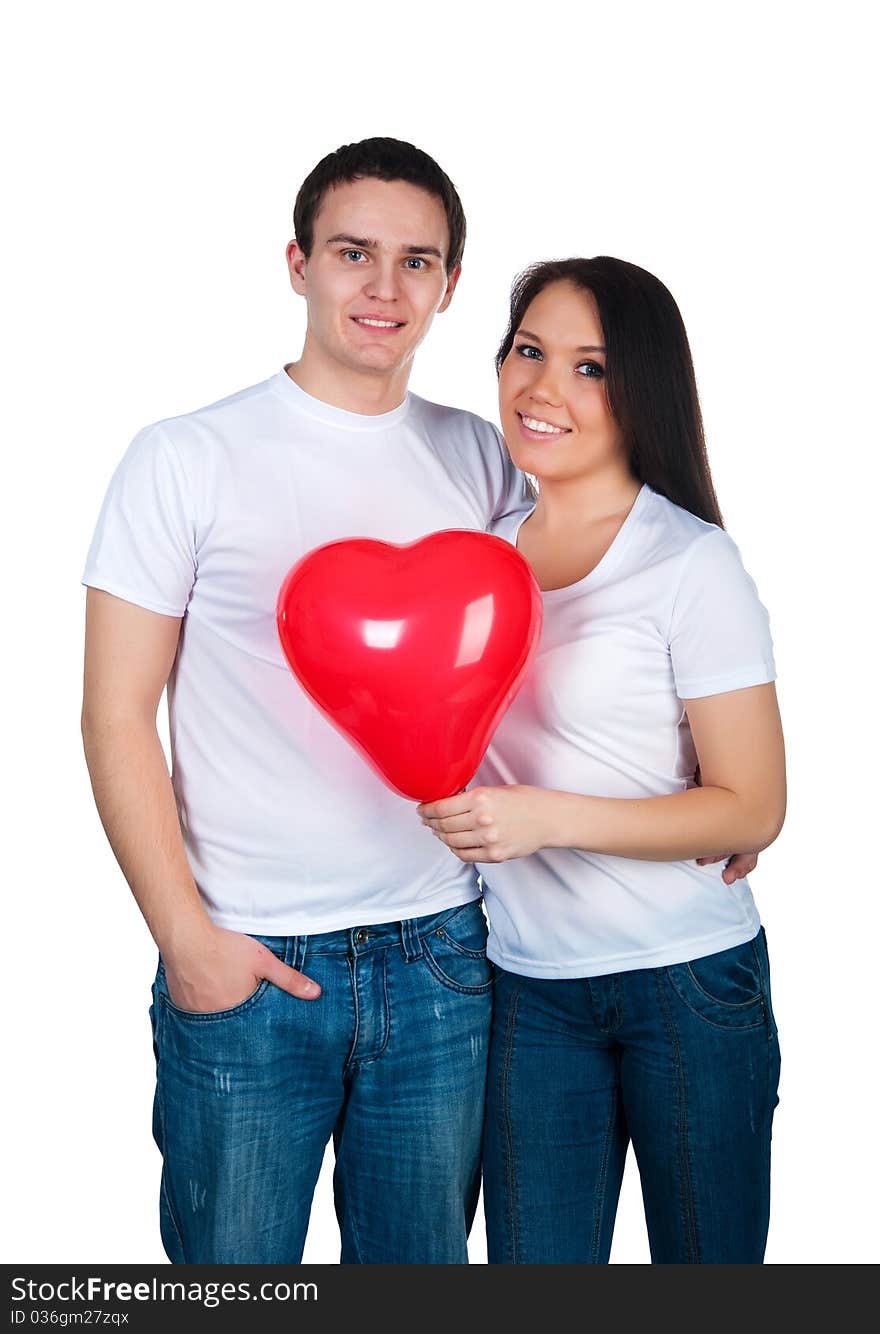 Young couple with a heart over white background