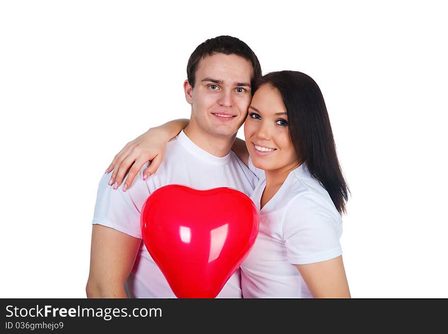 Young couple with a heart over white background