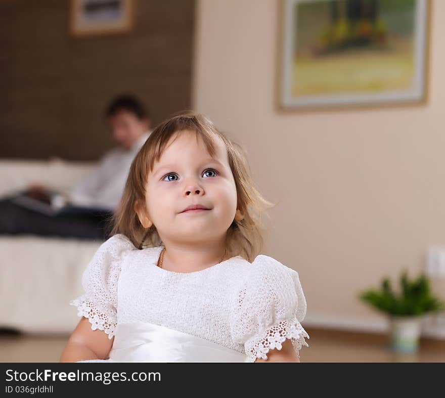 Little Girl Playing On The Floor