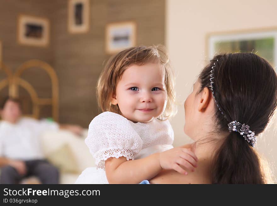 Young mother with a little daughter together at home. Young mother with a little daughter together at home