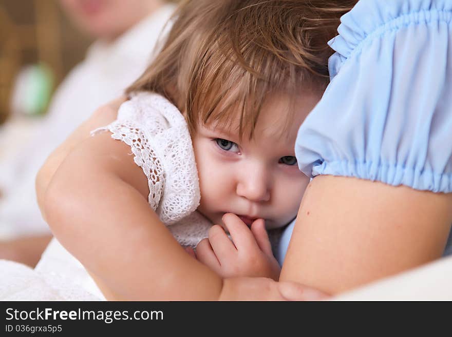 Young mother with a little daughter together at home. Young mother with a little daughter together at home