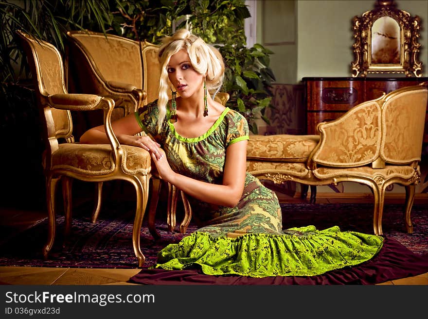 Majestic attractive blond girl in castle furniture. Majestic attractive blond girl in castle furniture