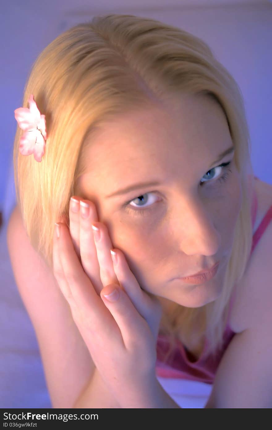 Portrait of a young woman with clear fair skin and manicured hands. Portrait of a young woman with clear fair skin and manicured hands