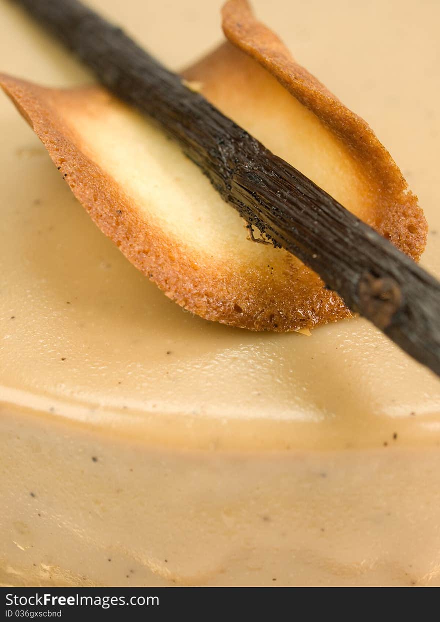 Cake of caramel with cinnamon and cookie isolated on white close-up