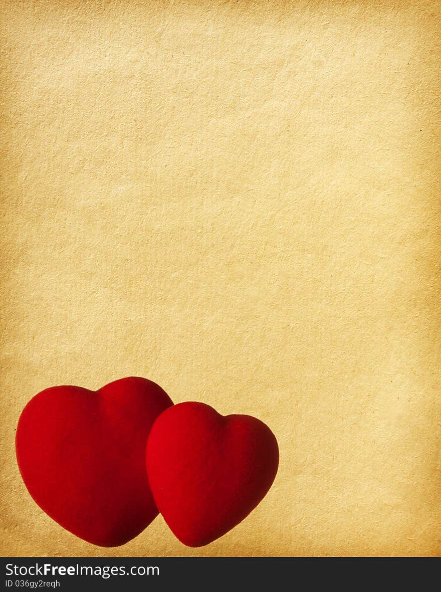 Aged paper texture. Two Hearts on paper