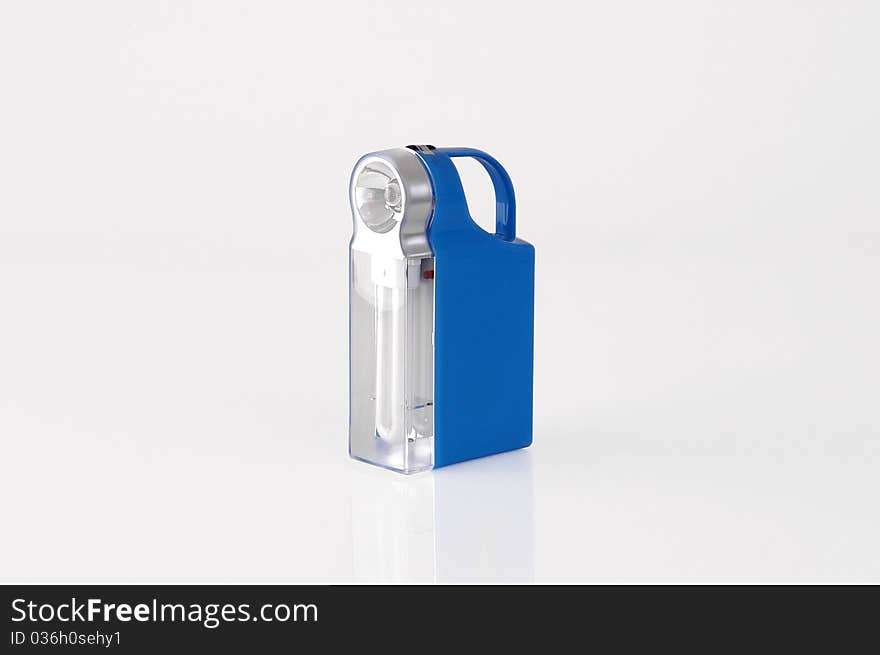 Blue flashlight on a white background