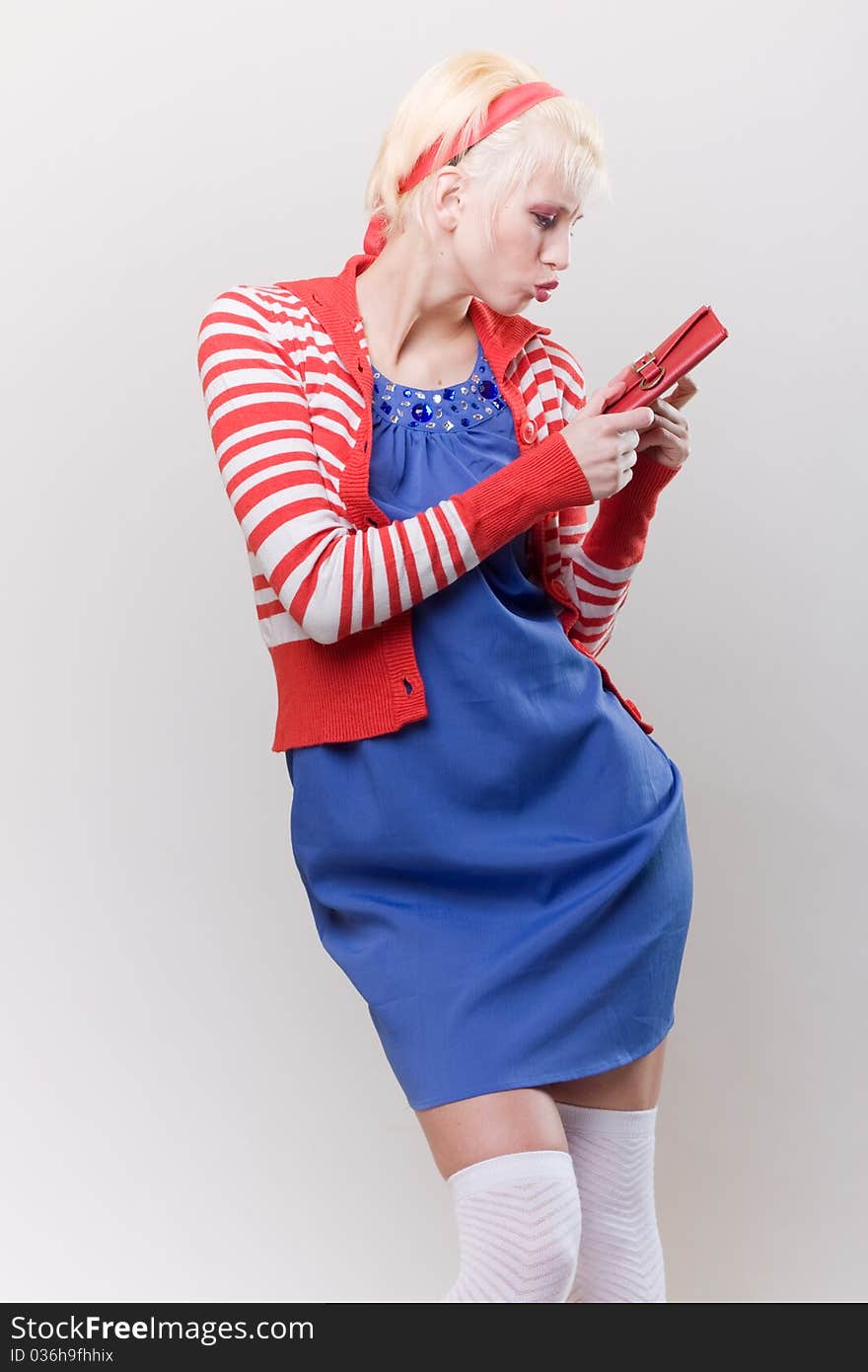 Emotion pose blond girl in red woolly