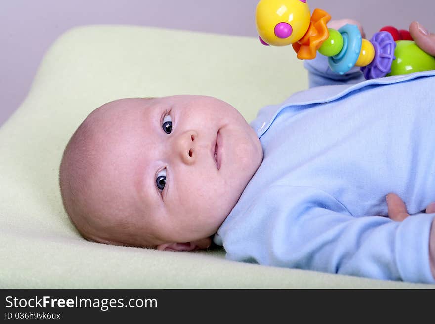 Mother plays with two months old baby boy. Mother plays with two months old baby boy.