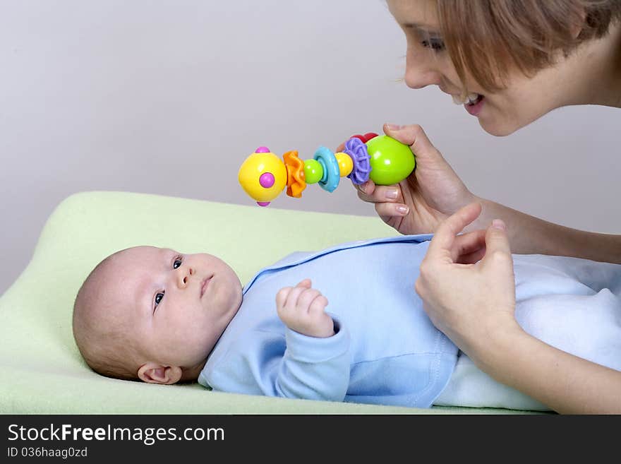 Mother plays with two months old baby boy. Mother plays with two months old baby boy.