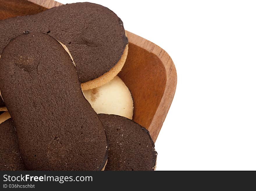 Biscuit dough with chocolate in a wooden bowl. Biscuit dough with chocolate in a wooden bowl.