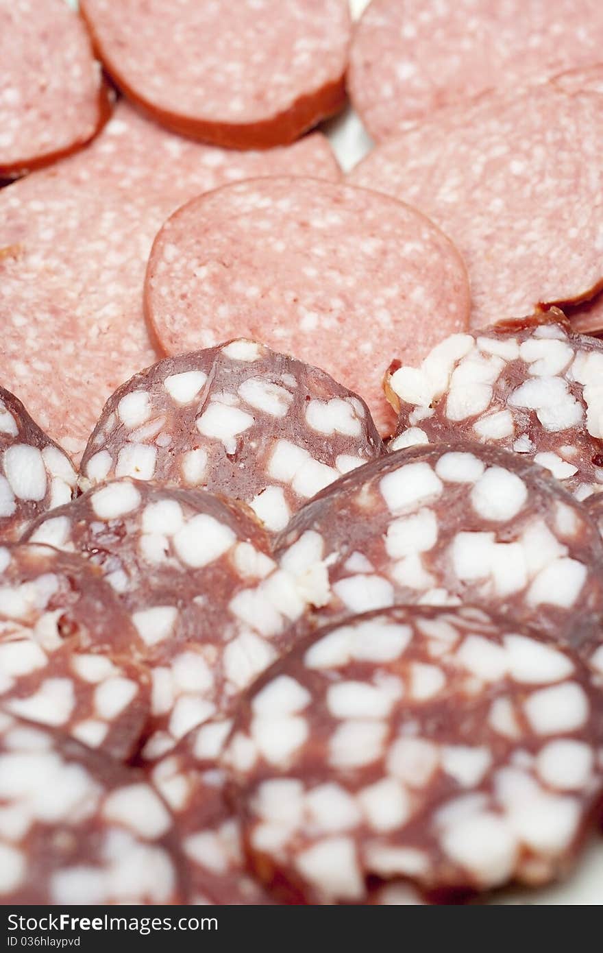 Slices of sausages on the plate