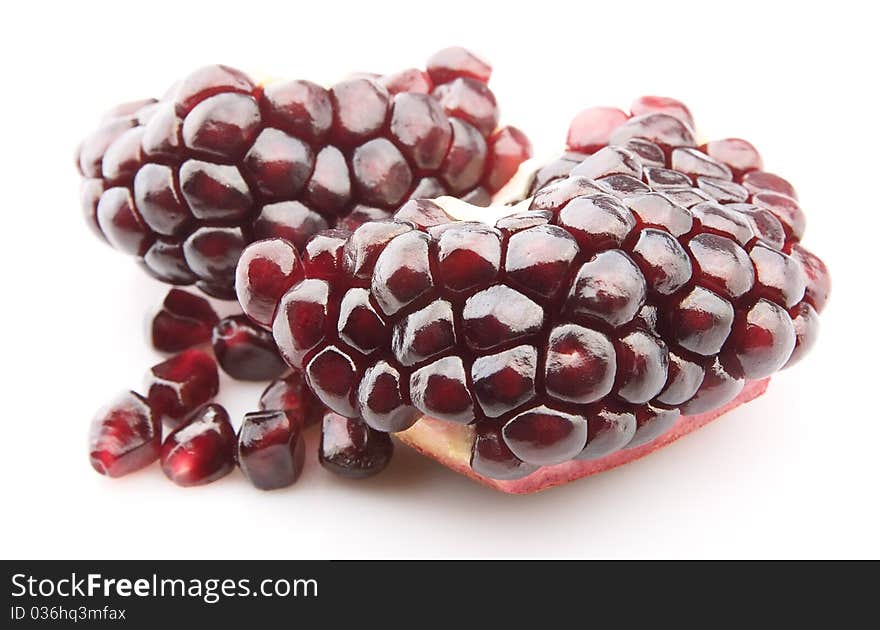 Pomegranate closeup on white background