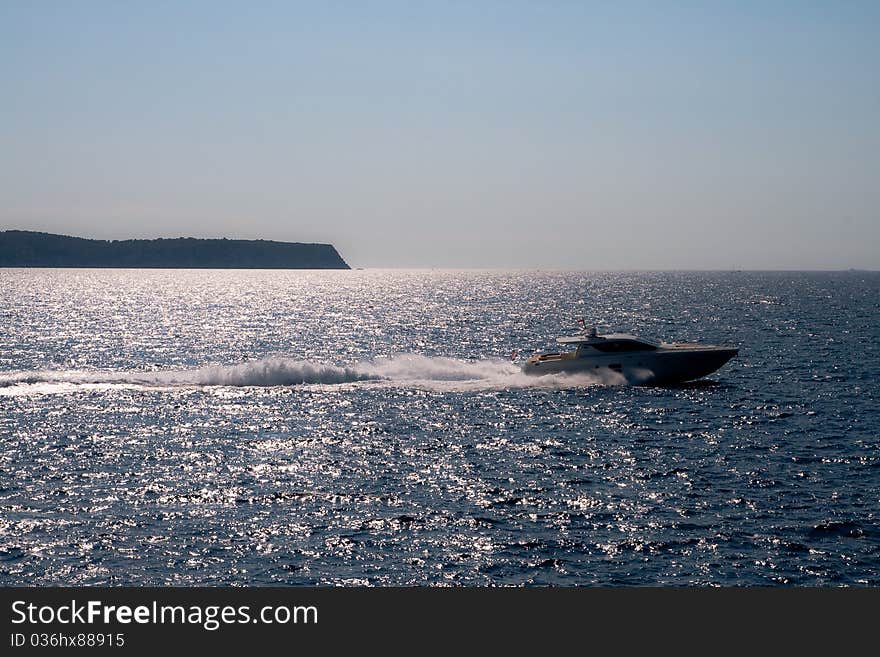 Speedboat on the sea in sunset