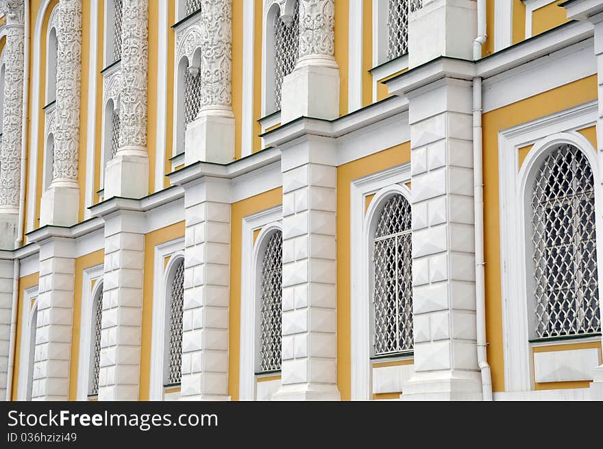 Facade of age-old house with grates on windows