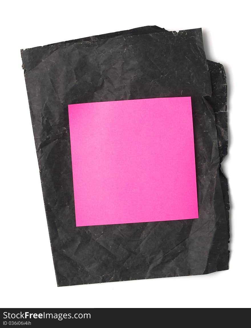 Pink stickers stuck on black paper