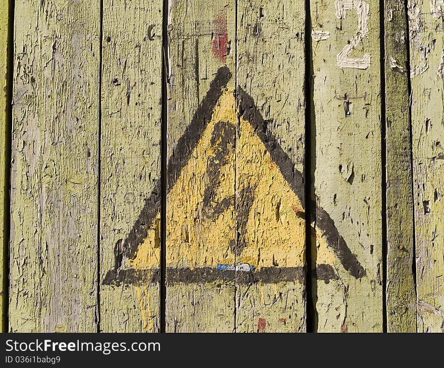 Sign--High voltage--on old wooden wall. Sign--High voltage--on old wooden wall