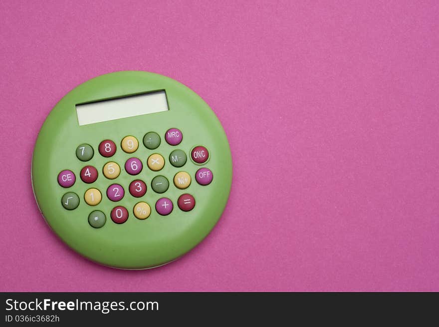 Unique Green Brigth Calculator on Vibrant Pink Background.