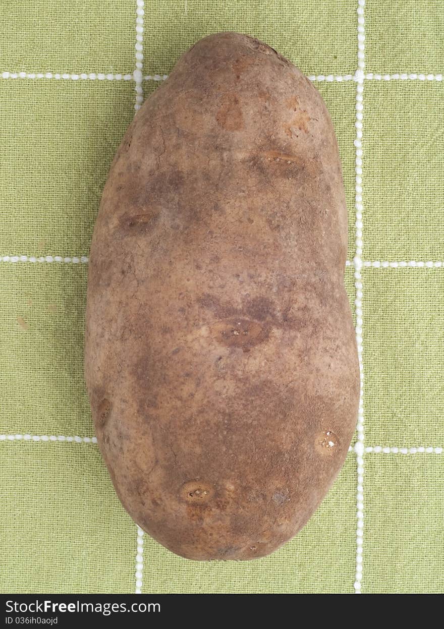 Potato on Green Kitchen Towel