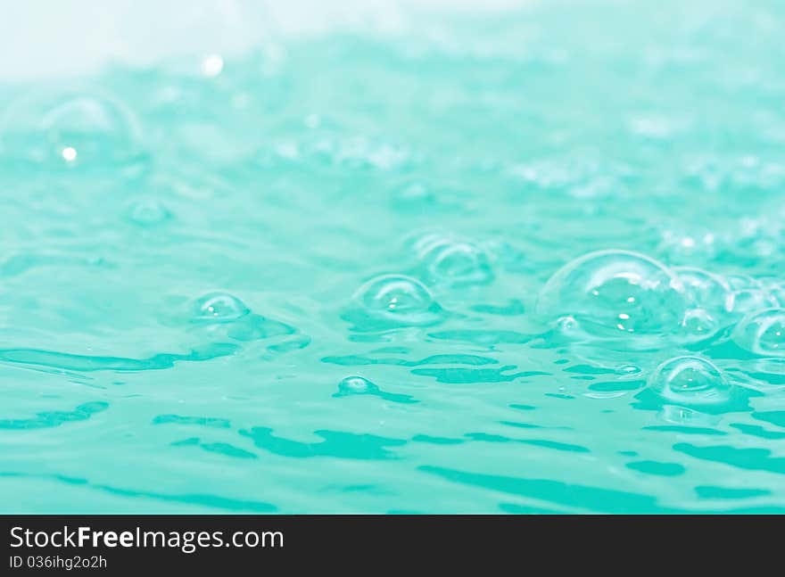 Bright water surface with vials