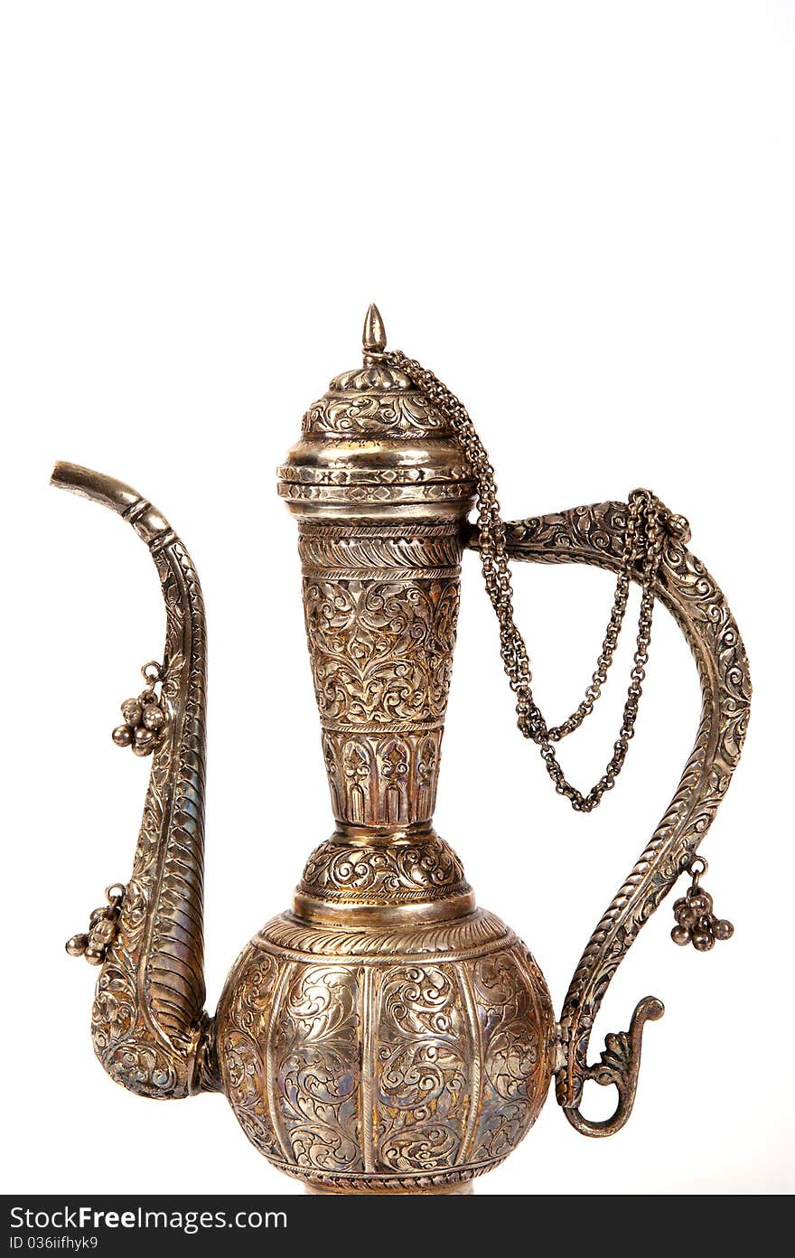 Copper jug with a traditional Arabic ornaments on a white background