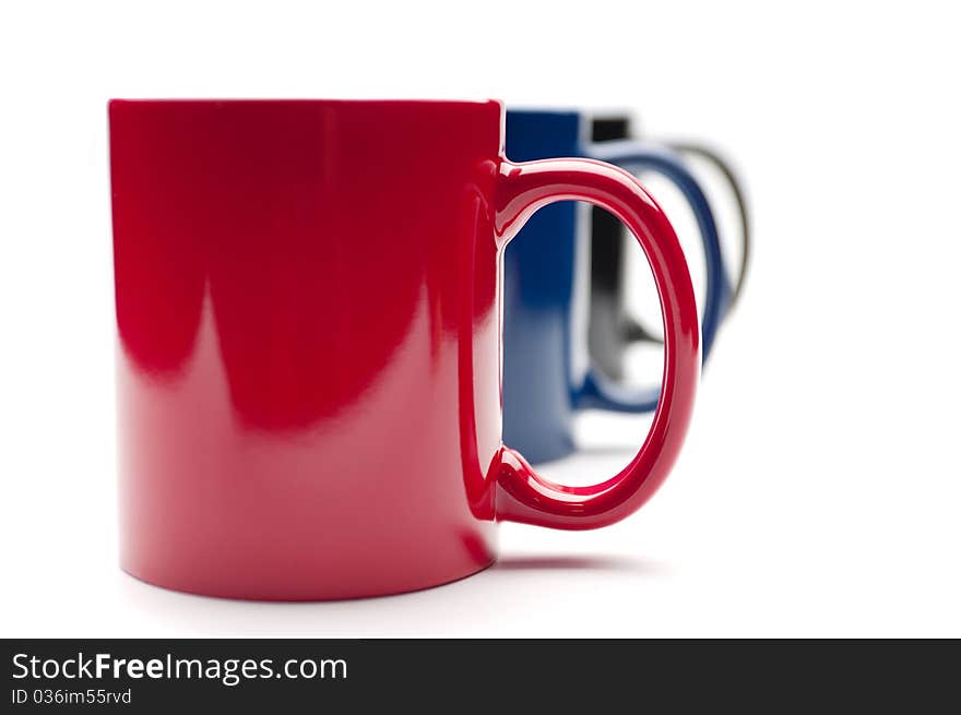 Three colorful cups on a white background