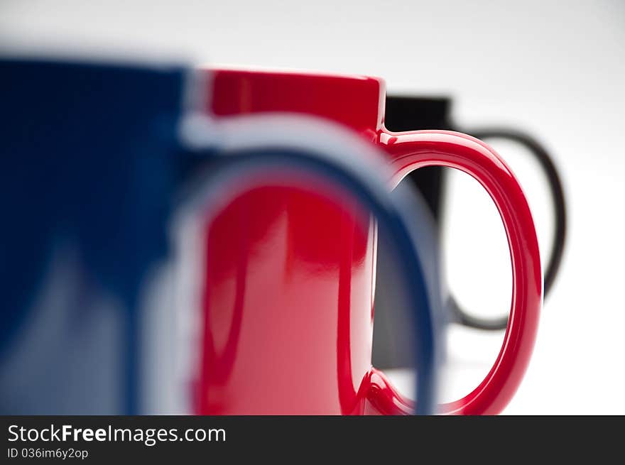 Three colorful cups on a white background