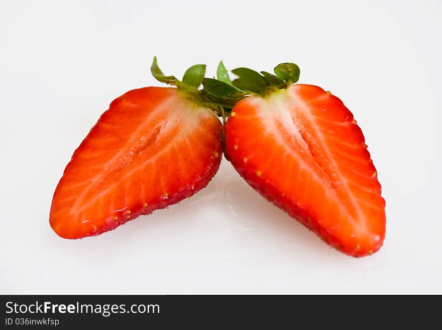 Strawberry halves on a white background