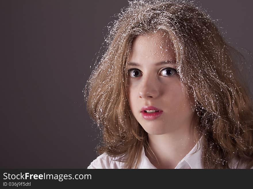 Portrait teenage girl with snow in hair