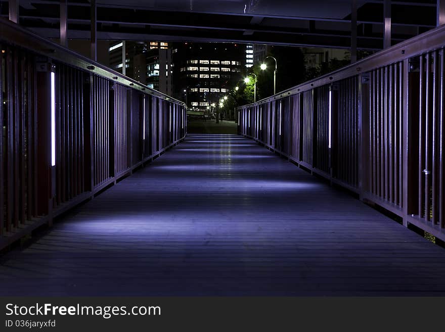 Small bridge along the canal,the light shines in the feet. Small bridge along the canal,the light shines in the feet