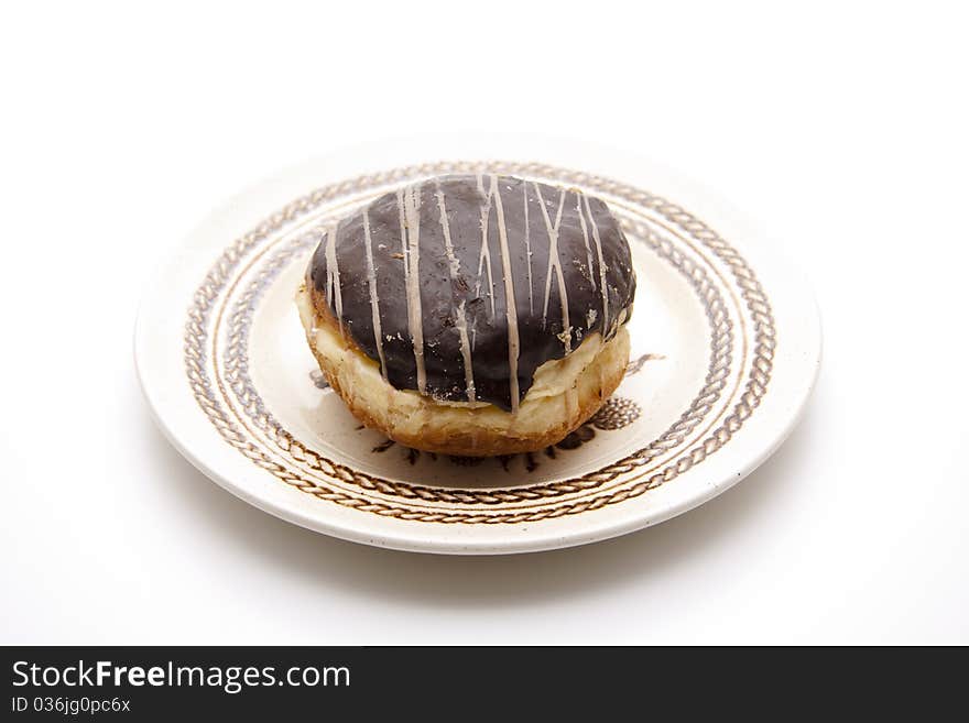 Donut with chocolates glaze onto plates