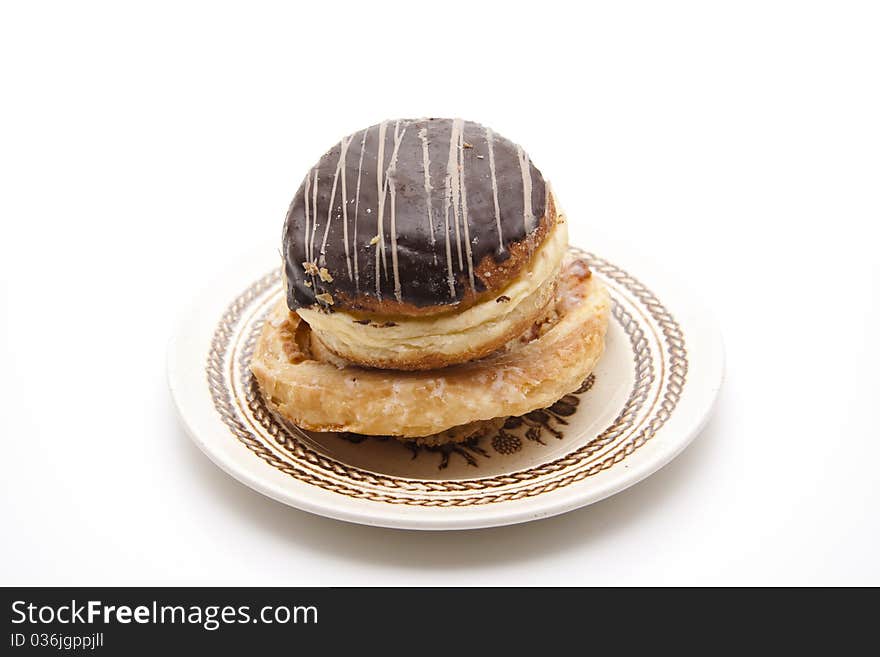 Donut with chocolates glaze onto plates