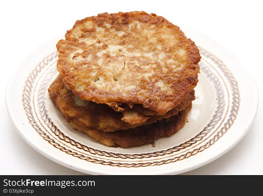 Potato pancakes crisply baked and onto plates