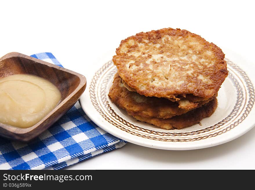 Potato pancake crisply baked with apple porridge and tablecloth