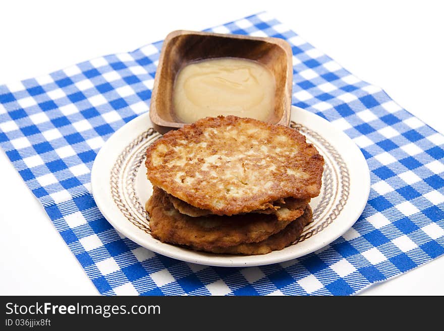 Potato pancake crisply baked with apple porridge and tablecloth