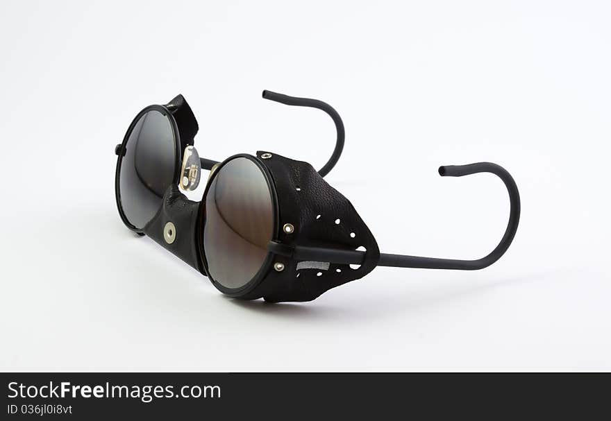 Leather shield sunglasses, special mountain, on white background. Leather shield sunglasses, special mountain, on white background