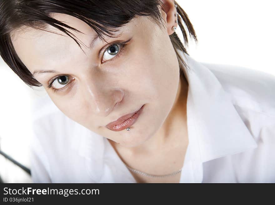 Close-up caucassian woman's face in white shirt