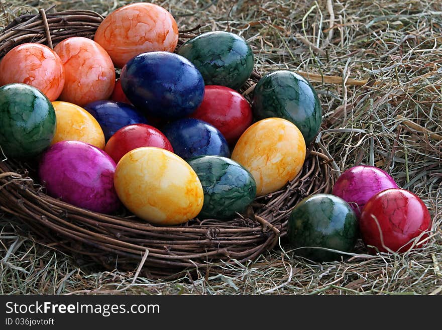 Colorful easter eggs in the hay