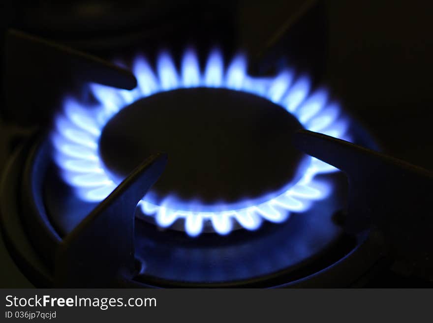 Blue Firing Gas Cooker In The Dark