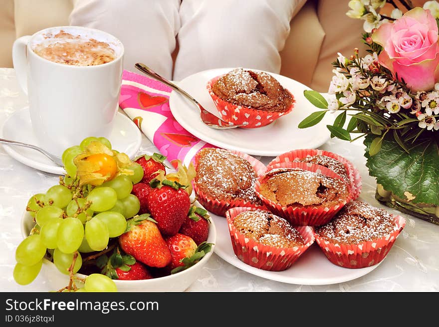 Muffin and fresh fruit on the breakfast table. Muffin and fresh fruit on the breakfast table