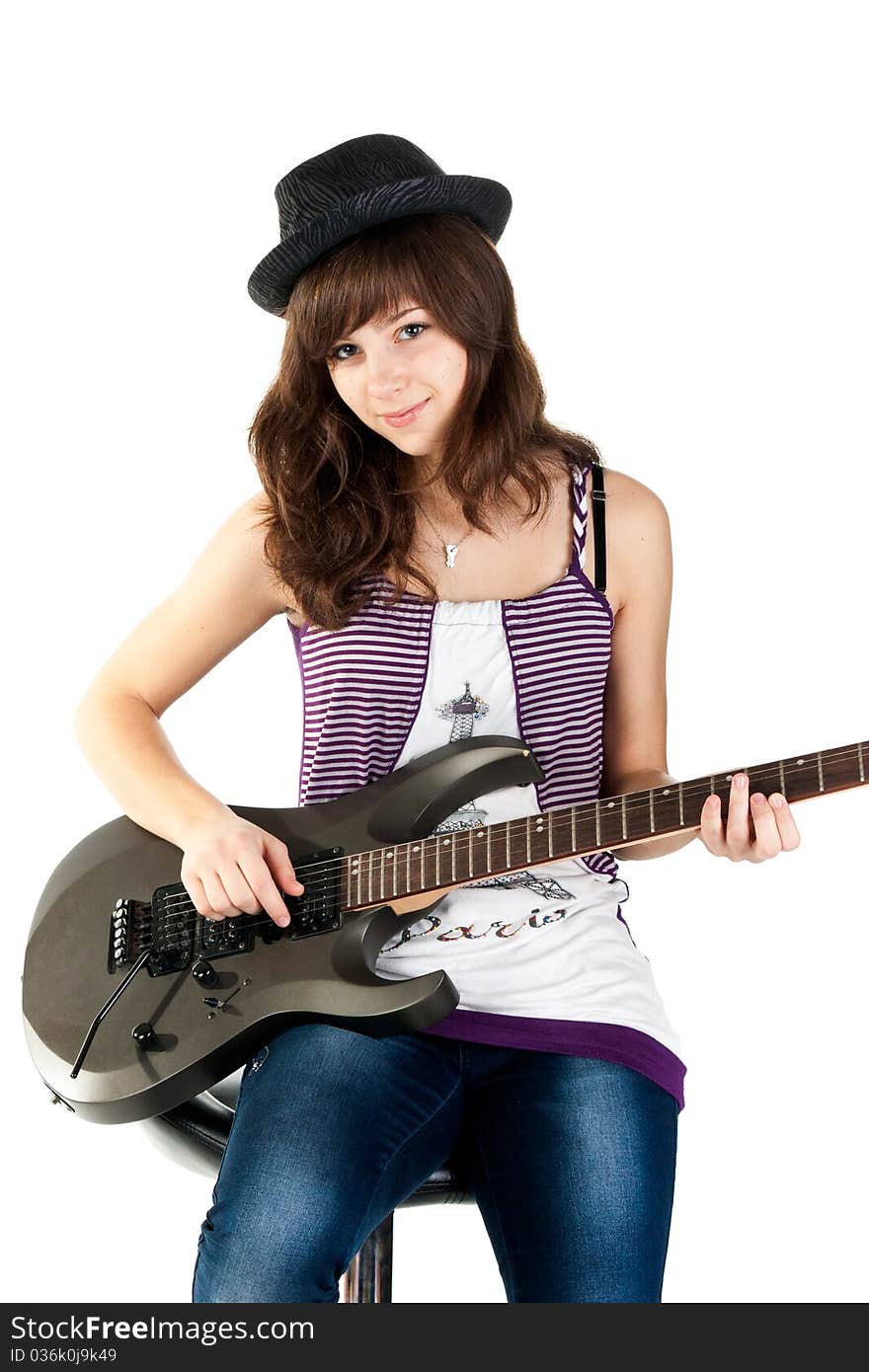 Beautiful girl playing the guitar isolated on white