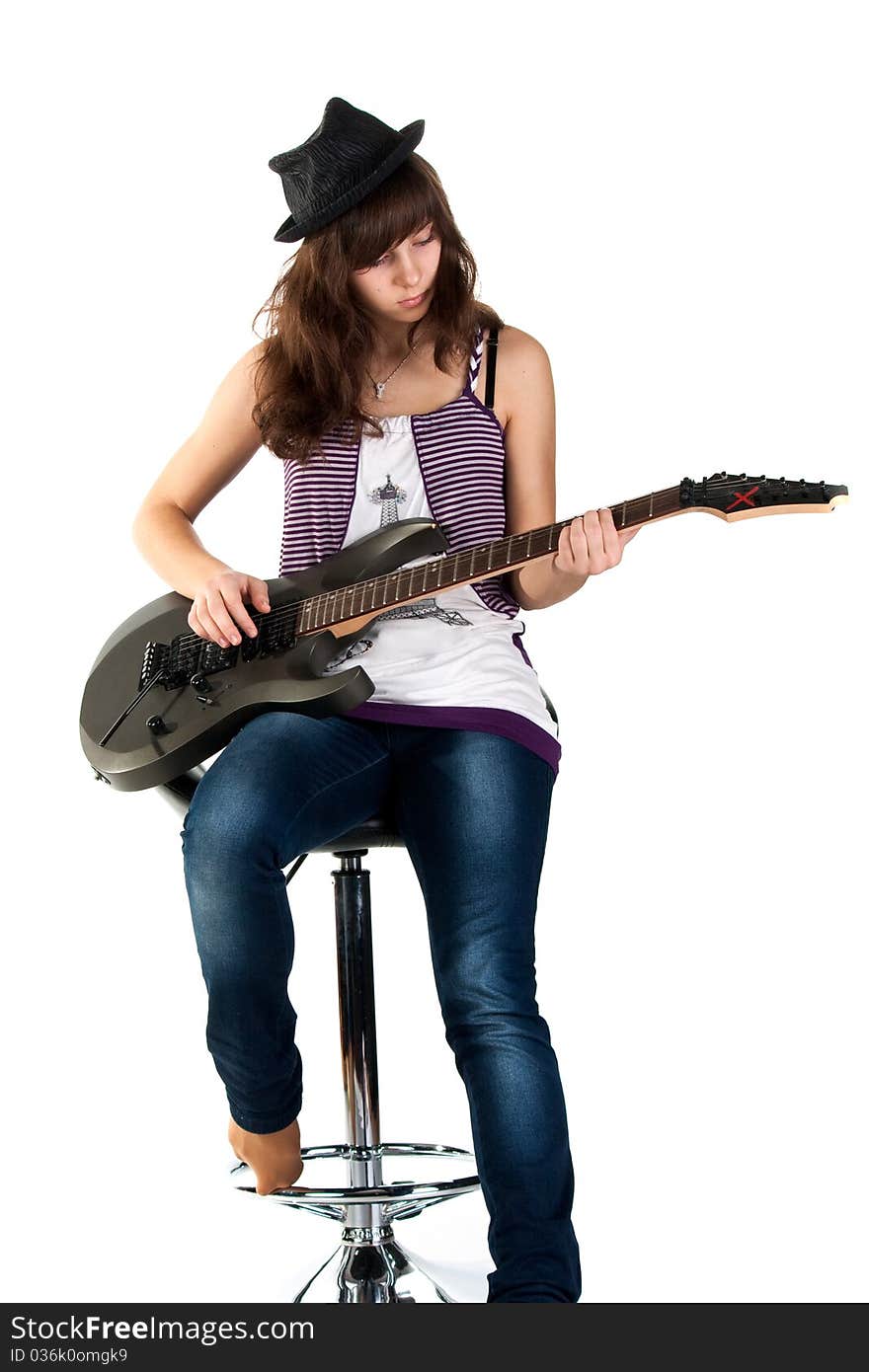 Beautiful girl playing the guitar