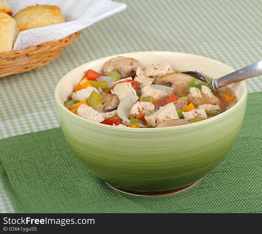 Chicken soup with mushrooms and vegetables in a bowl. Chicken soup with mushrooms and vegetables in a bowl