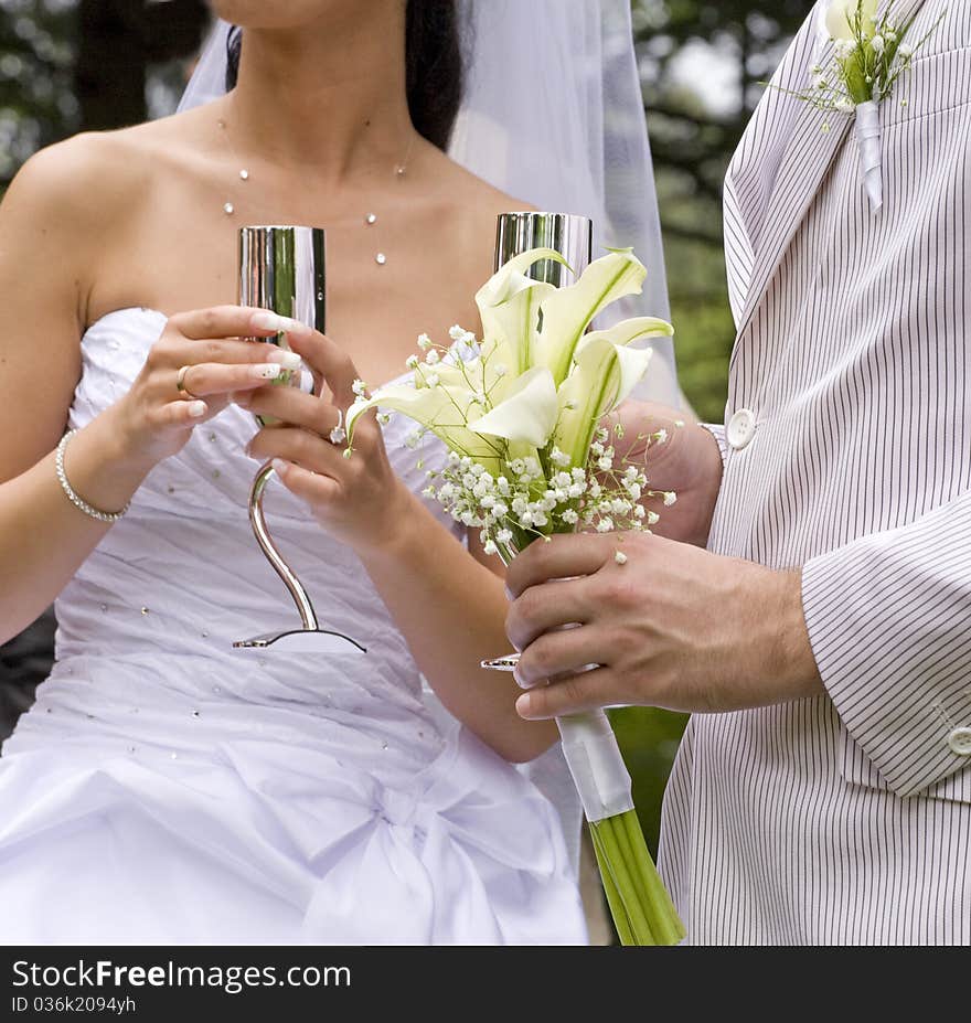 Fiance and bride keep steel glass