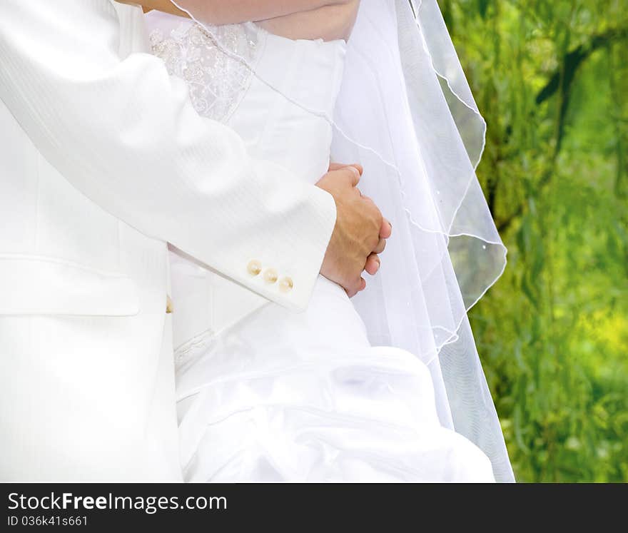 Wedding moments - fiance hugs bride