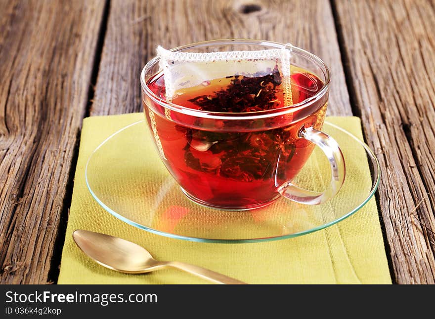 Fruit tea in a glass cup - closeup