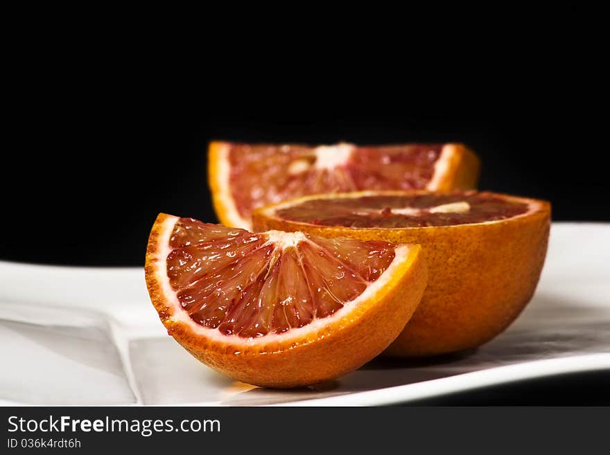 Orange slice shot in the studio isolated on black. Orange slice shot in the studio isolated on black.