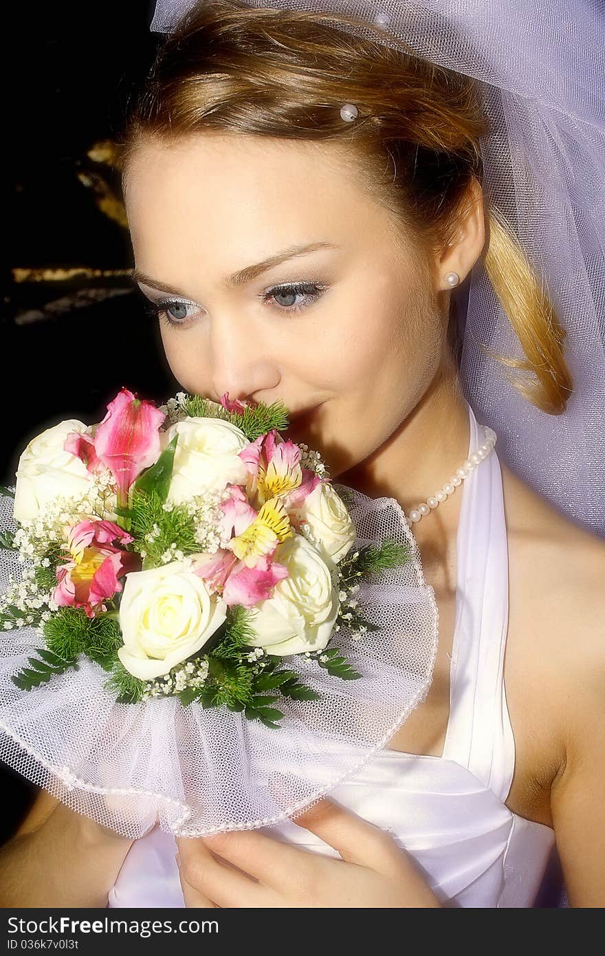 The gentle, beautiful, is mysterious-romantic bride with a wedding bouquet. The gentle, beautiful, is mysterious-romantic bride with a wedding bouquet