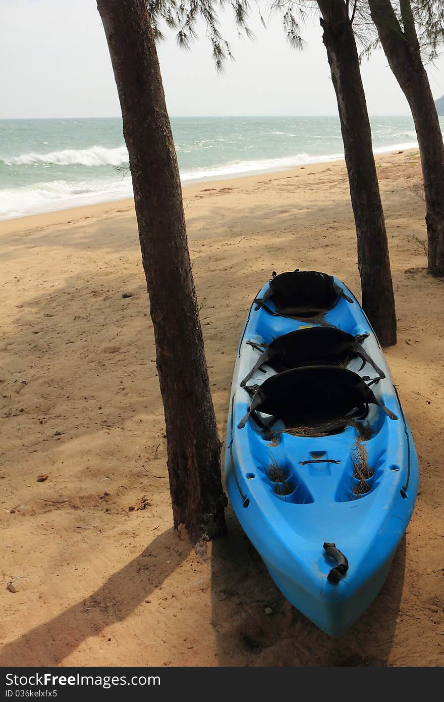 Blue kayak on the beach and sunny day